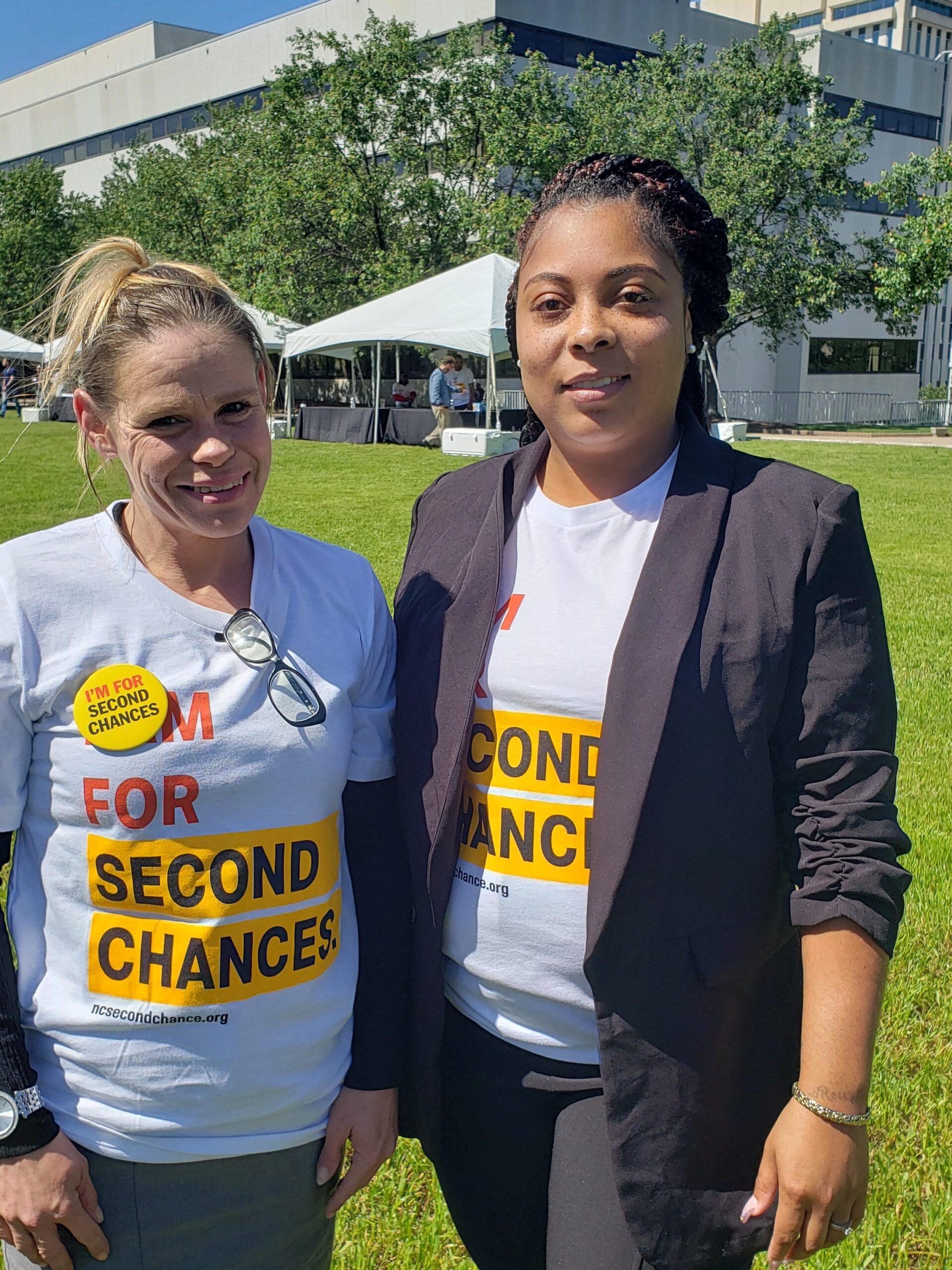 Pictured: Katie Anderson, Second Chance Alamance Project Manager (left) and Mona Evans, Family Reunification Advocate (right) standing before the NC Legislative Office Building on Second Chance Lobby Day.